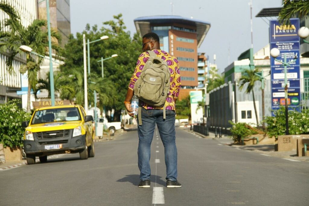 Man with backpack in Ivory Coast